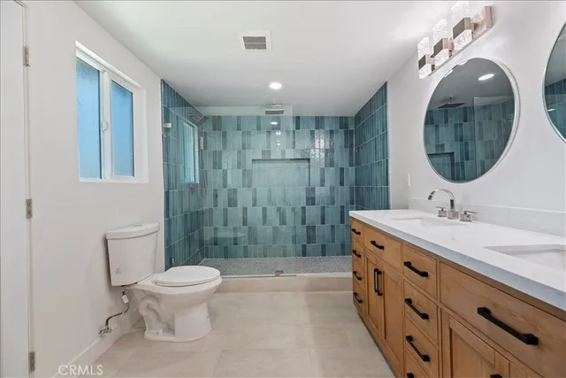 a bathroom with a sink a mirror and a shower