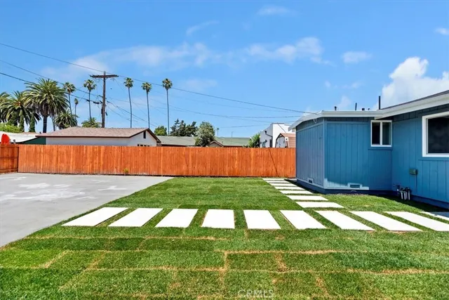 a view of swimming pool with an outdoor seating and a garage
