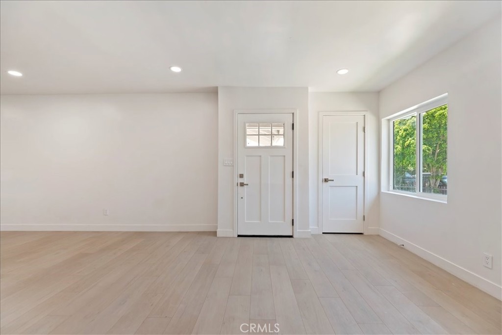 3011 5th Los Angeles, CA 90018 - Photo 9 of 44 an empty room with windows and closet
