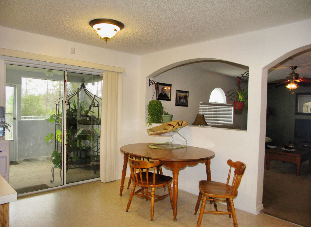 55492 Bear Run Road Callahan, FL 32011 - Photo 8 of 24 a view of a dining room with furniture window and outside view