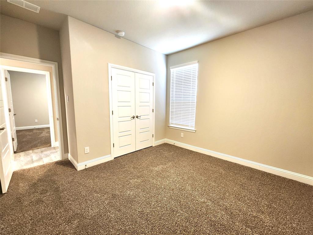 1521 Razorbill Road Denton, TX 76205 - Photo 16 of 31 an empty room with windows