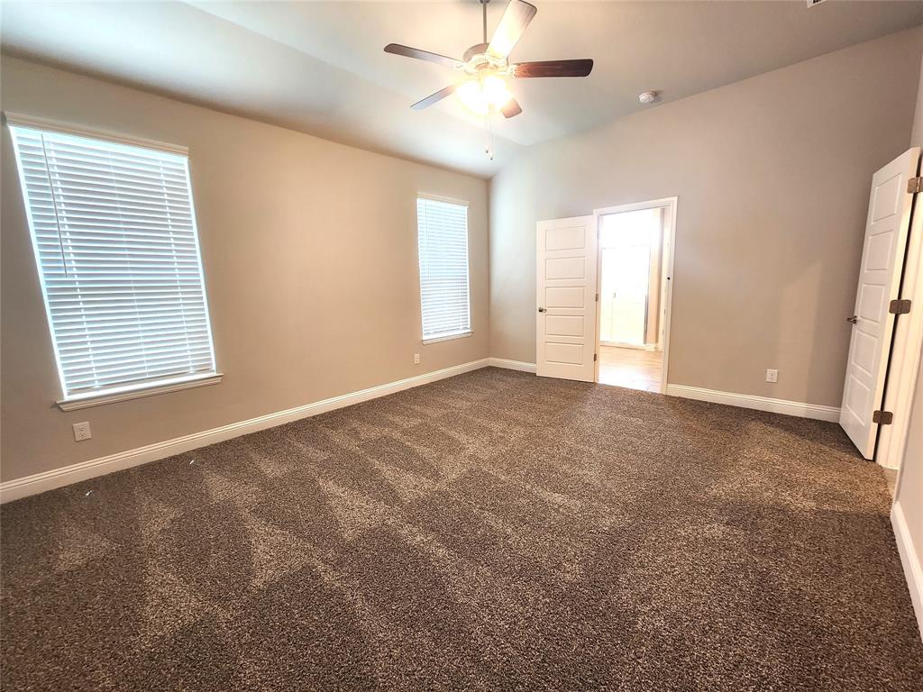 1521 Razorbill Road Denton, TX 76205 - Photo 21 of 31 a view of an empty room with a window