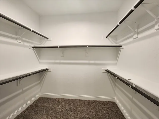 a view of an empty walk in closet