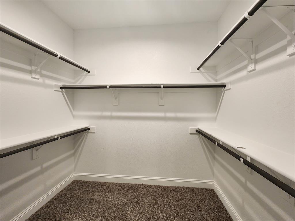 1521 Razorbill Road Denton, TX 76205 - Photo 23 of 31 a view of an empty walk in closet