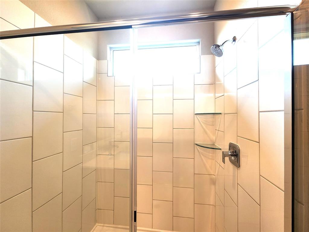 1521 Razorbill Road Denton, TX 76205 - Photo 24 of 31 a bathroom with a shower