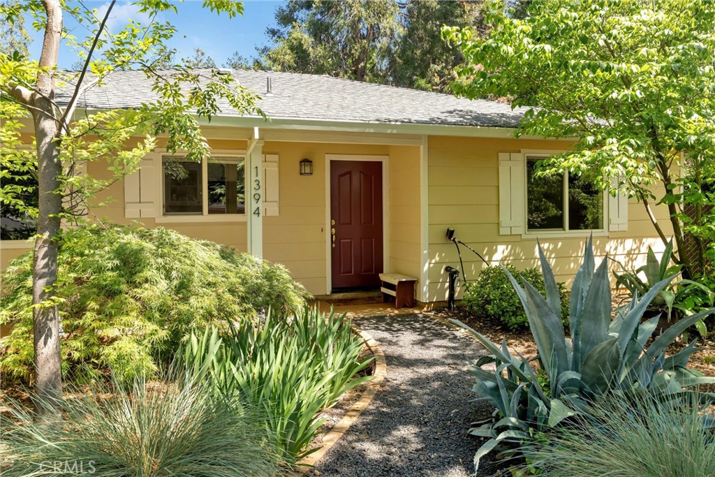 1394 Wagstaff Road Paradise, CA 95969 - Photo 2 of 46 a front view of a house with garden