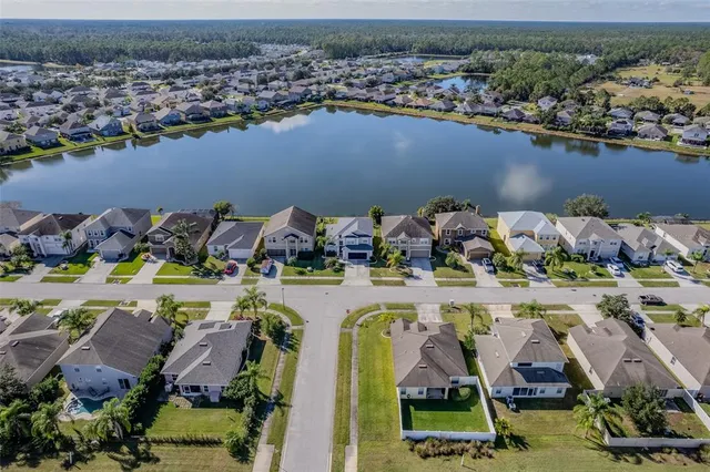 an aerial view of a houses with outdoor space