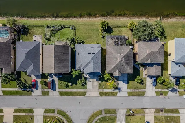 an aerial view of a house with a lake view