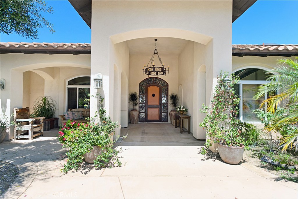 4106 Rock Mountain Road Fallbrook, CA 92028 - Photo 1 of 36 a front view of a house with a garden