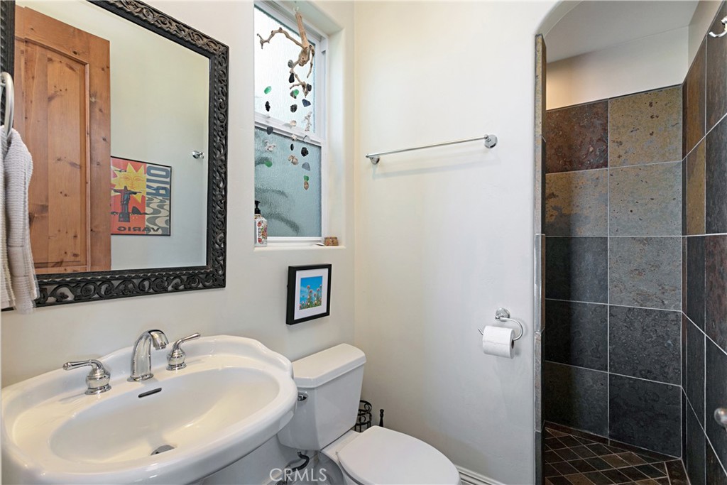 4106 Rock Mountain Road Fallbrook, CA 92028 - Photo 17 of 36 a bathroom with a sink toilet and shower