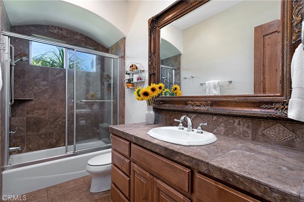 4106 Rock Mountain Road Fallbrook, CA 92028 - Photo 19 of 36 a bathroom with a sink a toilet and shower