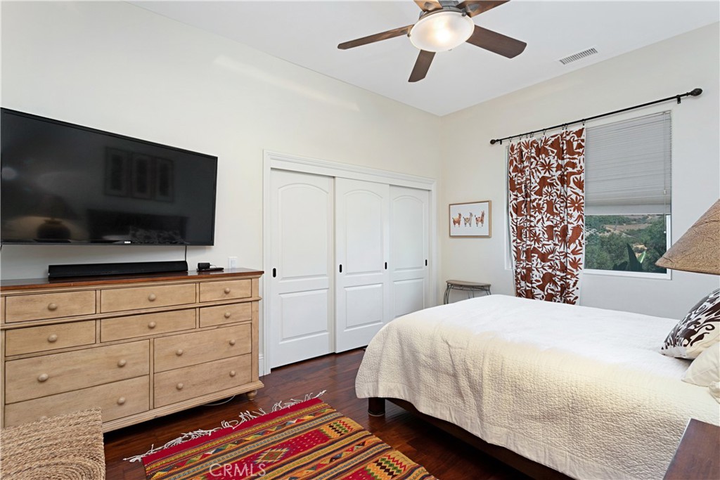 4106 Rock Mountain Road Fallbrook, CA 92028 - Photo 20 of 36 a bedroom with a bed and a flat screen tv