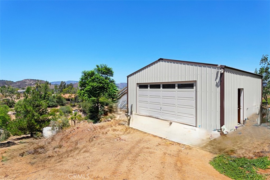 4106 Rock Mountain Road Fallbrook, CA 92028 - Photo 31 of 36 a front view of a house with a yard