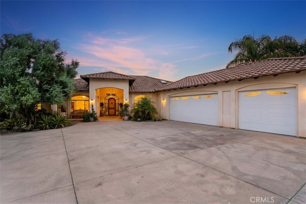 4106 Rock Mountain Road Fallbrook, CA 92028 - Photo 6 of 36 a view of a house with a yard and garage