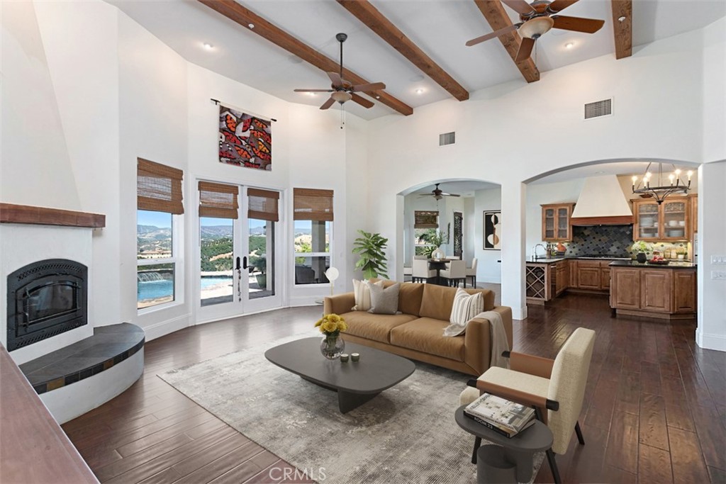 4106 Rock Mountain Road Fallbrook, CA 92028 - Photo 9 of 36 a living room with furniture and a fireplace