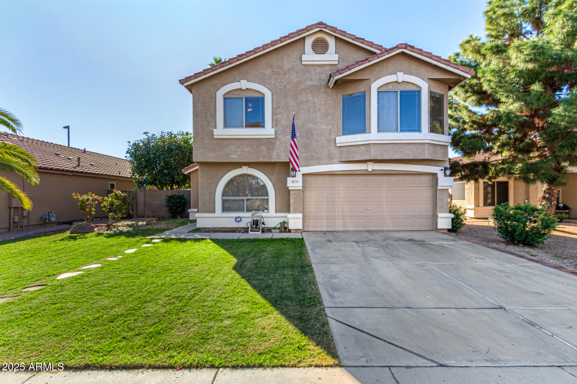 a front view of house with yard and green space