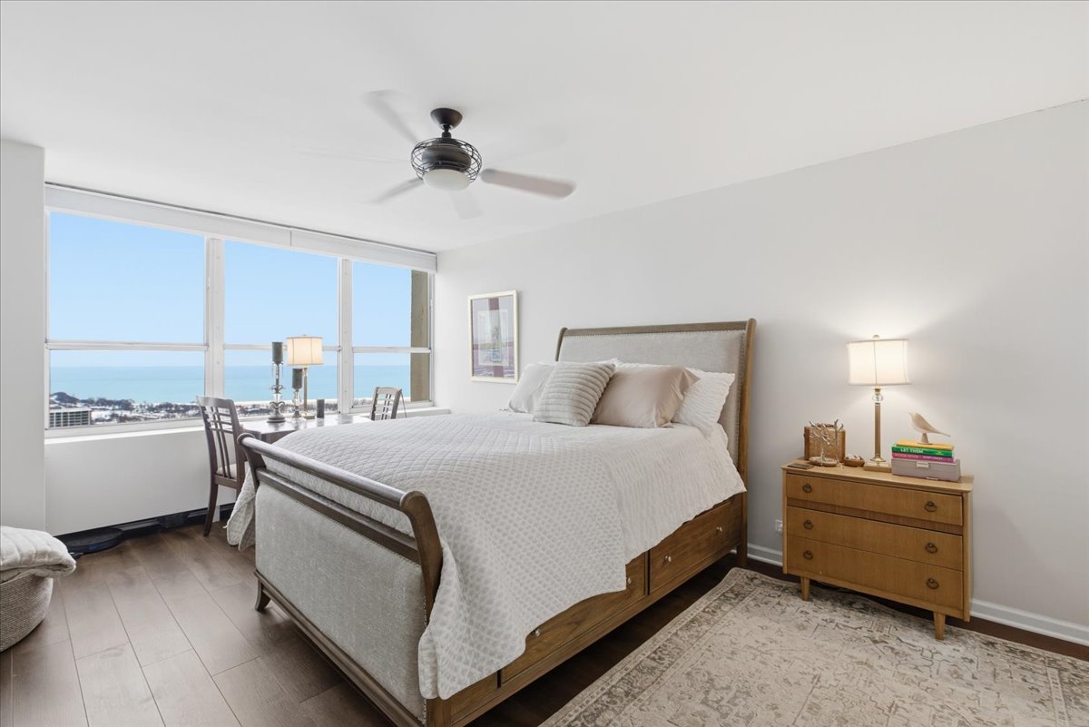 655 West Irving Park Road, Unit 4412 Chicago, IL 60613 - Photo 9 of 19 a spacious bedroom with a bed and a dresser