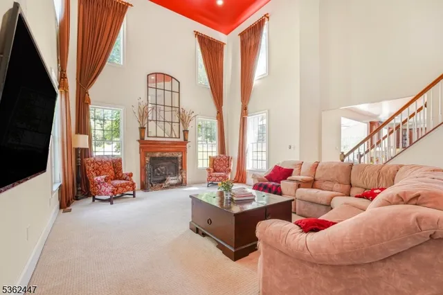 a living room with furniture fireplace and flat screen tv