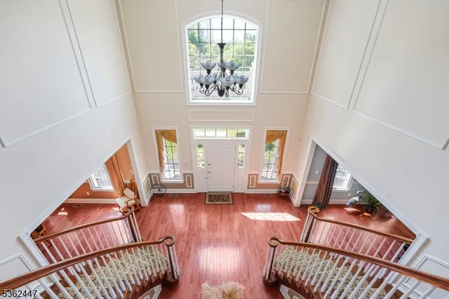 a view of an entryway with wooden floor