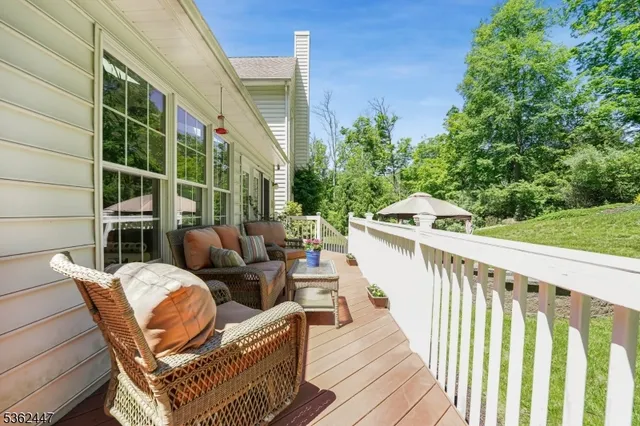 a view of balcony with furniture and garden