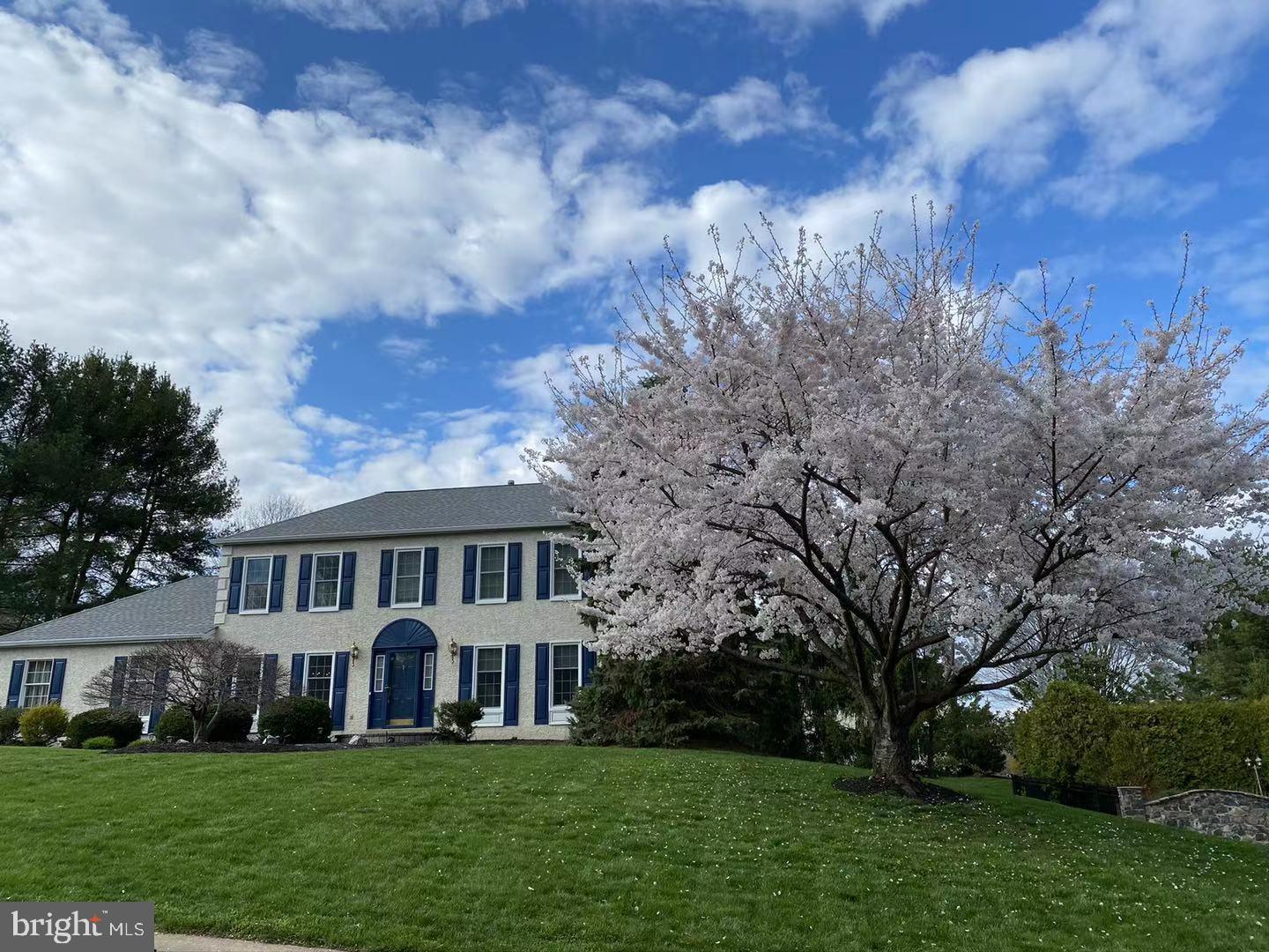 104 Bridle Path East Hockessin, DE 19707 - Photo 2 of 36 spring with cherry blossom