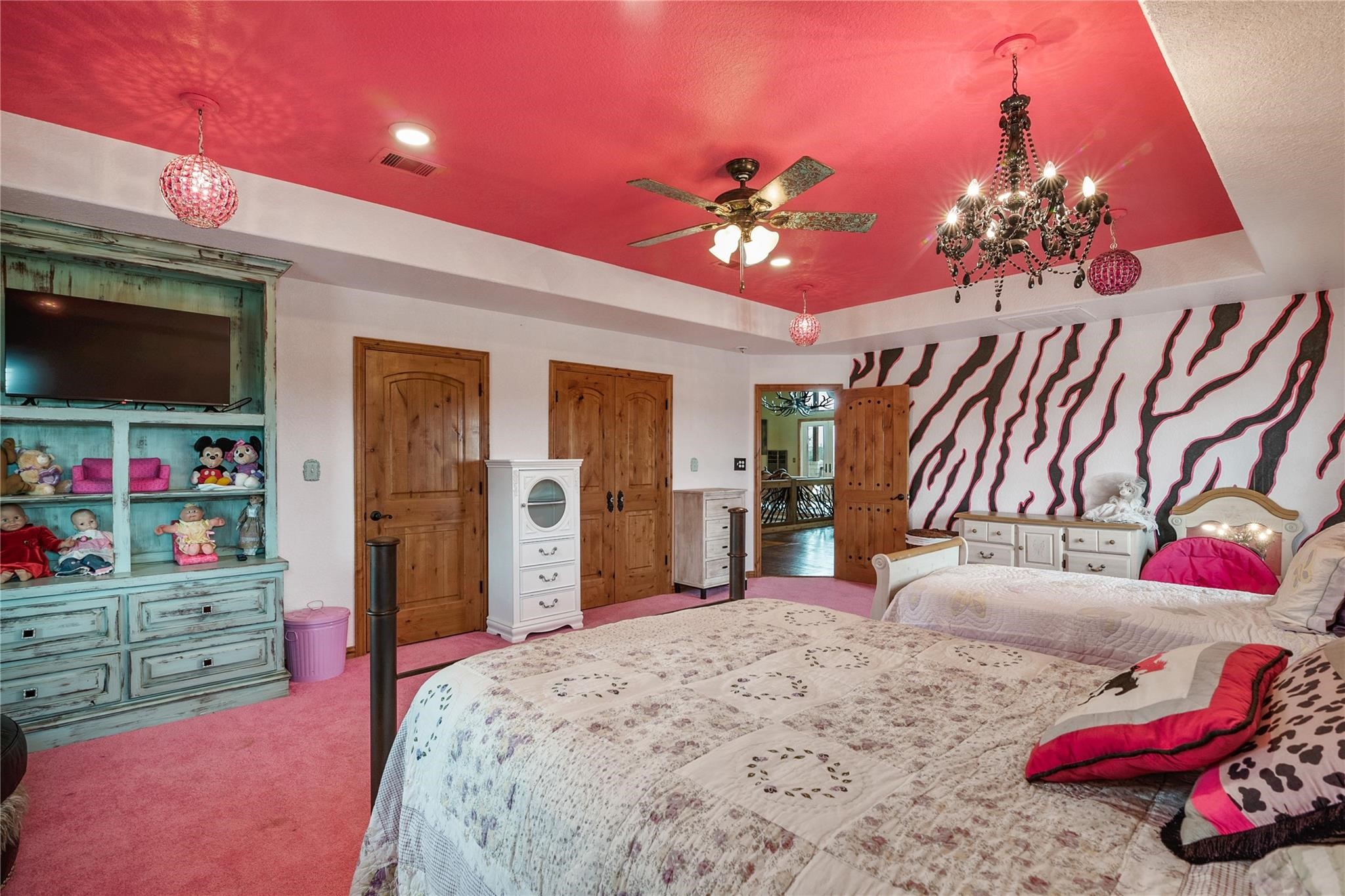 8821 FM 524 Road Sweeny, TX 77480 - Photo 32 of 47 a bedroom with a bed and a flat screen tv