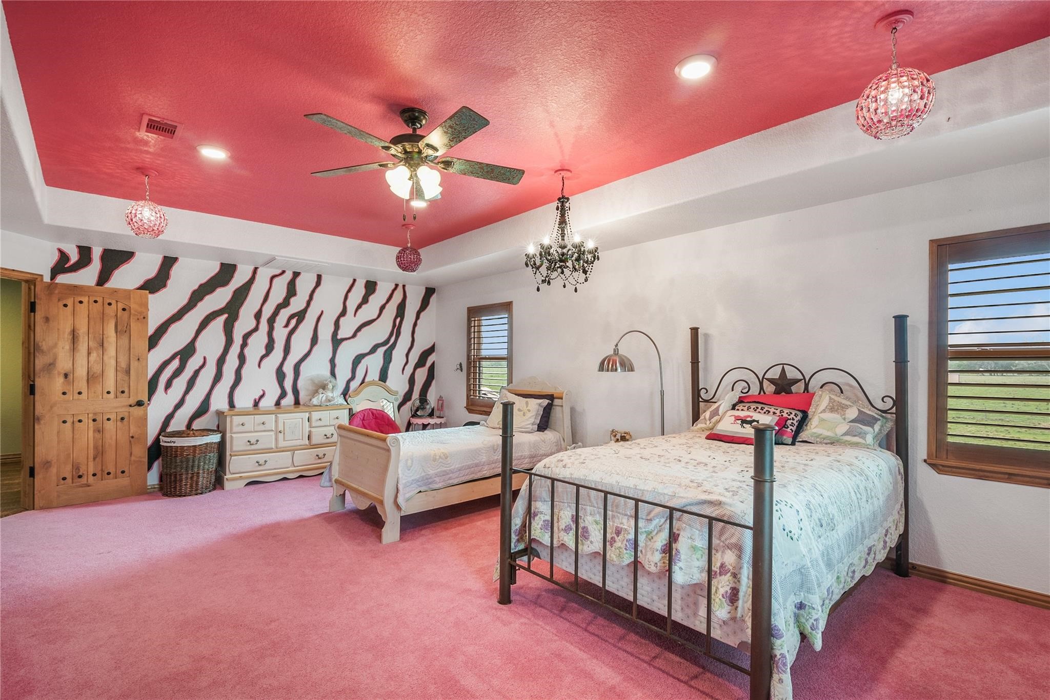 8821 FM 524 Road Sweeny, TX 77480 - Photo 33 of 47 a bedroom with furniture and a chandelier