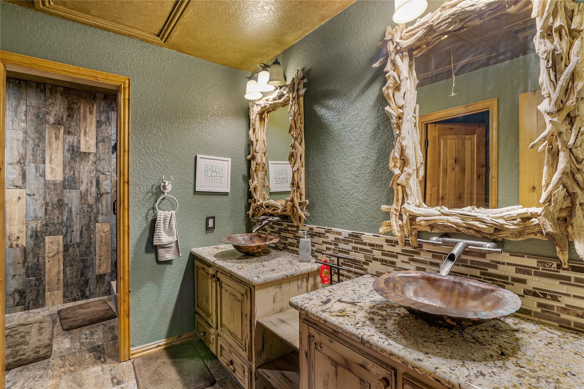 8821 FM 524 Road Sweeny, TX 77480 - Photo 34 of 47 a bathroom with a granite countertop sink a mirror and shower
