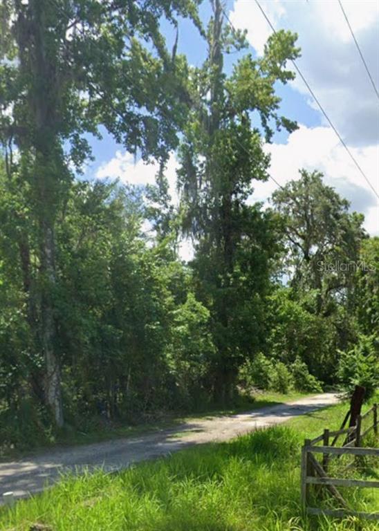 0 Southwest 30th Drive Webster, FL 33597 - Photo 2 of 2 a view of outdoor space with deck and yard