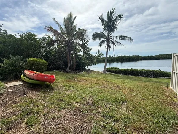 a view of a lake with a big yard