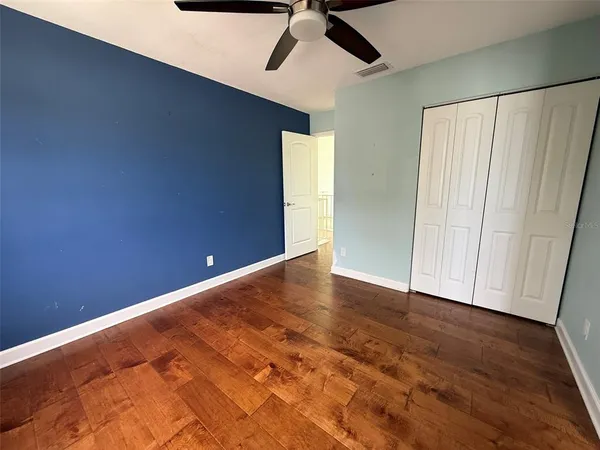 a bathroom with a toilet a sink a mirror and bathtub