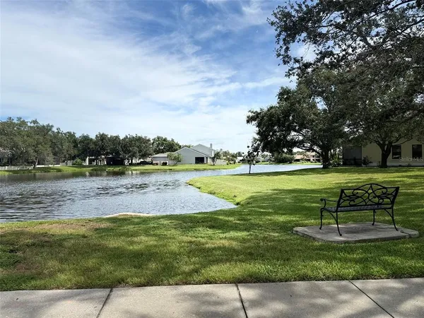 a dining room with furniture and a large window