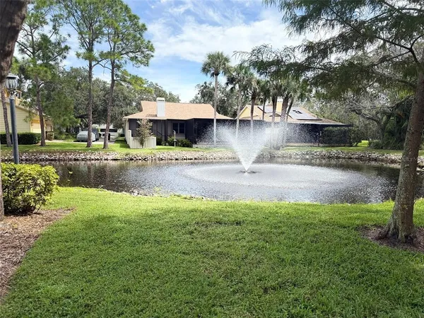 a view of a backyard with sitting area