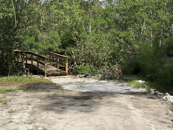a view of a forest with a houses