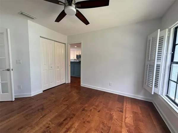 a bathroom with a double vanity sink mirror and toilet