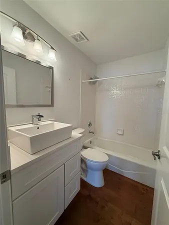 a kitchen with stainless steel appliances granite countertop a refrigerator sink and cabinets