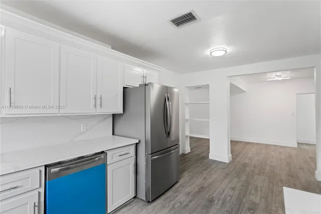 a bathroom with a double vanity sink and mirror