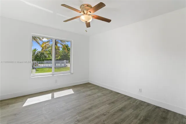 a view of an empty room and window