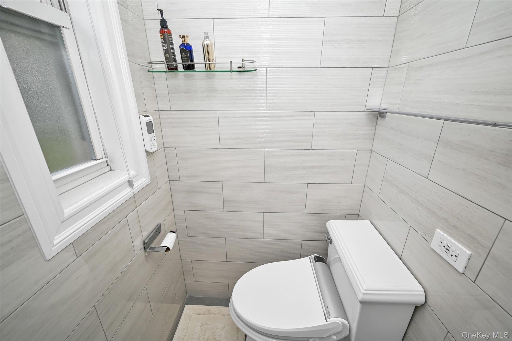 97-37 63rd Road, Unit 2J Queens, NY 11374 - Photo 16 of 19 a bathroom with a toilet and a shower