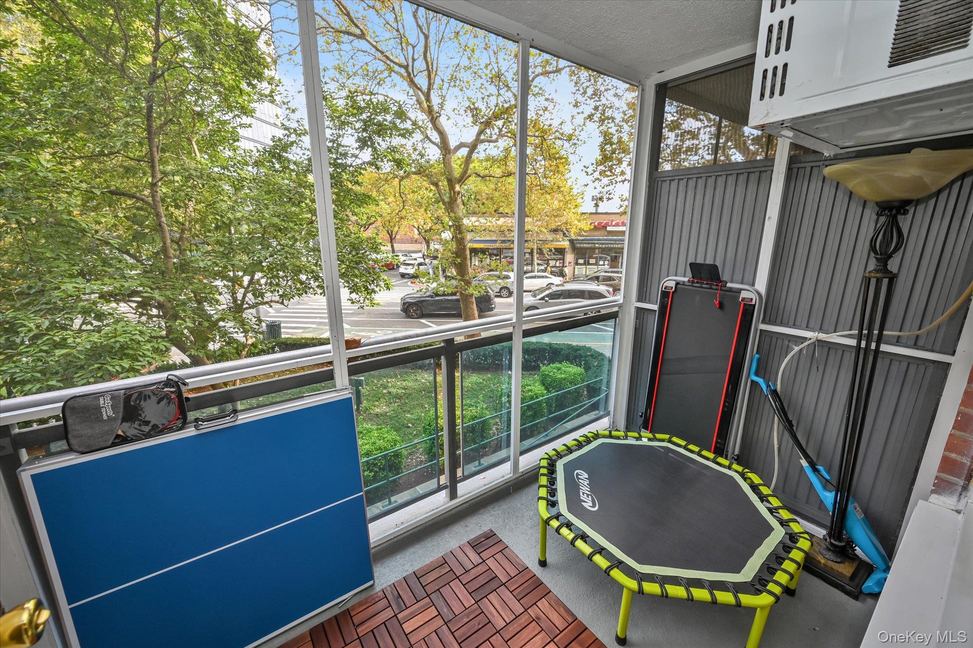 97-37 63rd Road, Unit 2J Queens, NY 11374 - Photo 18 of 19 a bathroom with a toilet a sink and a mirror