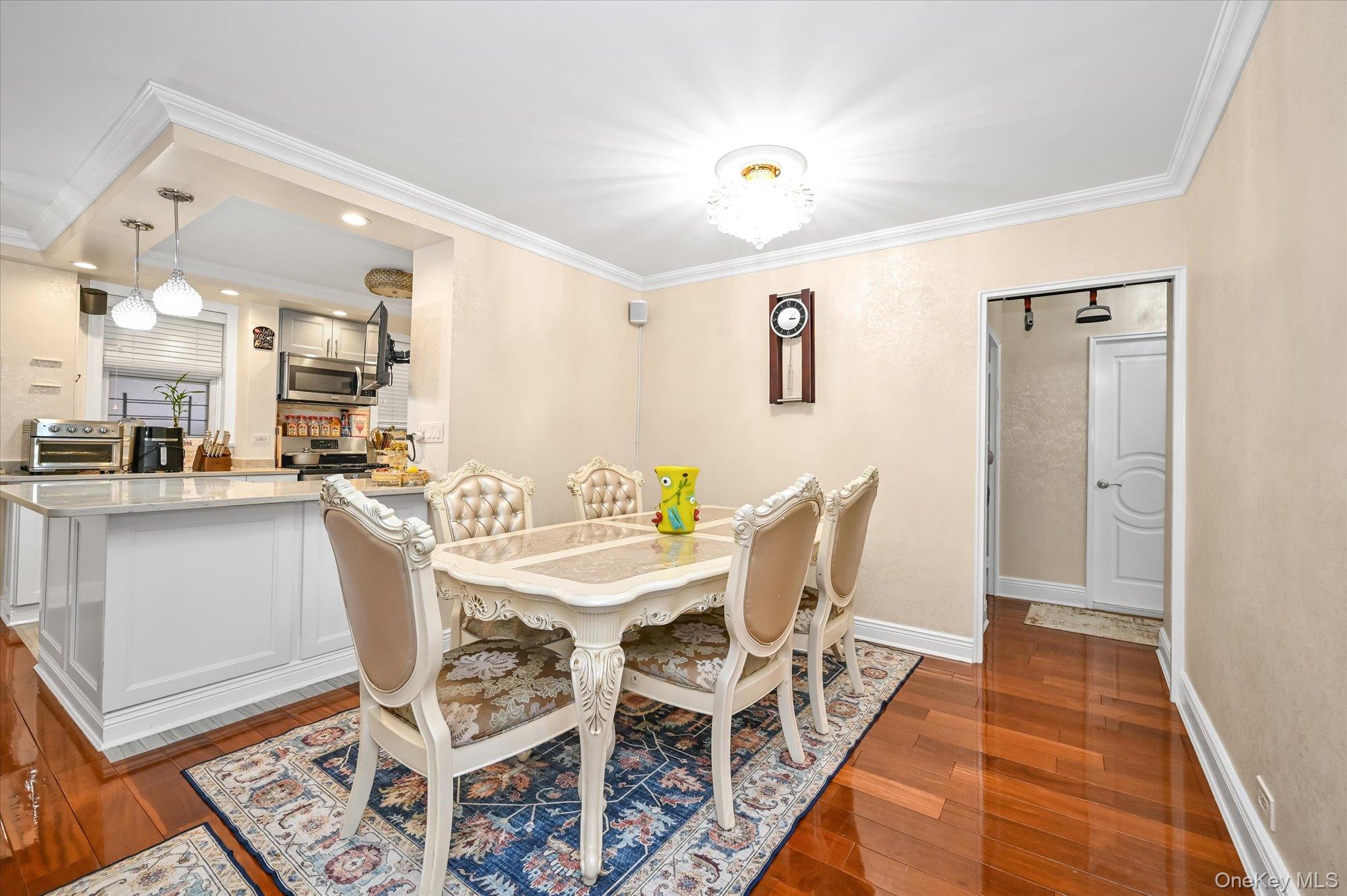 97-37 63rd Road, Unit 2J Queens, NY 11374 - Photo 5 of 19 a view of a dining room with furniture