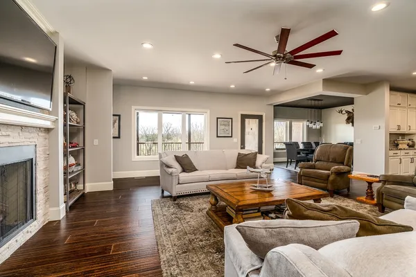 a large kitchen with stainless steel appliances granite countertop a stove and a sink