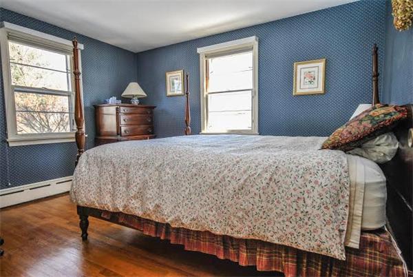 36 Hunting Road Needham, MA 02494 - Photo 6 of 11 a bedroom with a bed and a window