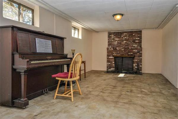36 Hunting Road Needham, MA 02494 - Photo 7 of 11 a room with furniture and a fireplace