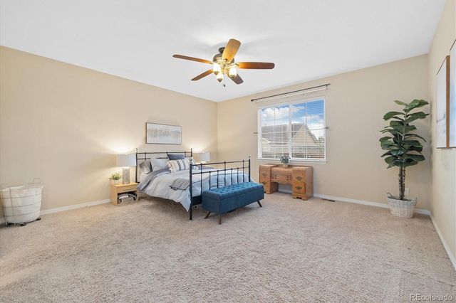 a bedroom with furniture and a window