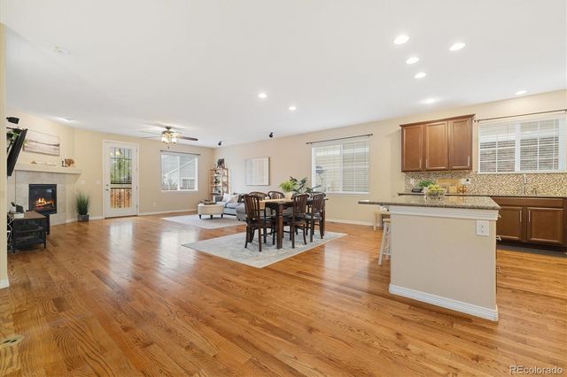 a living room with furniture and kitchen view
