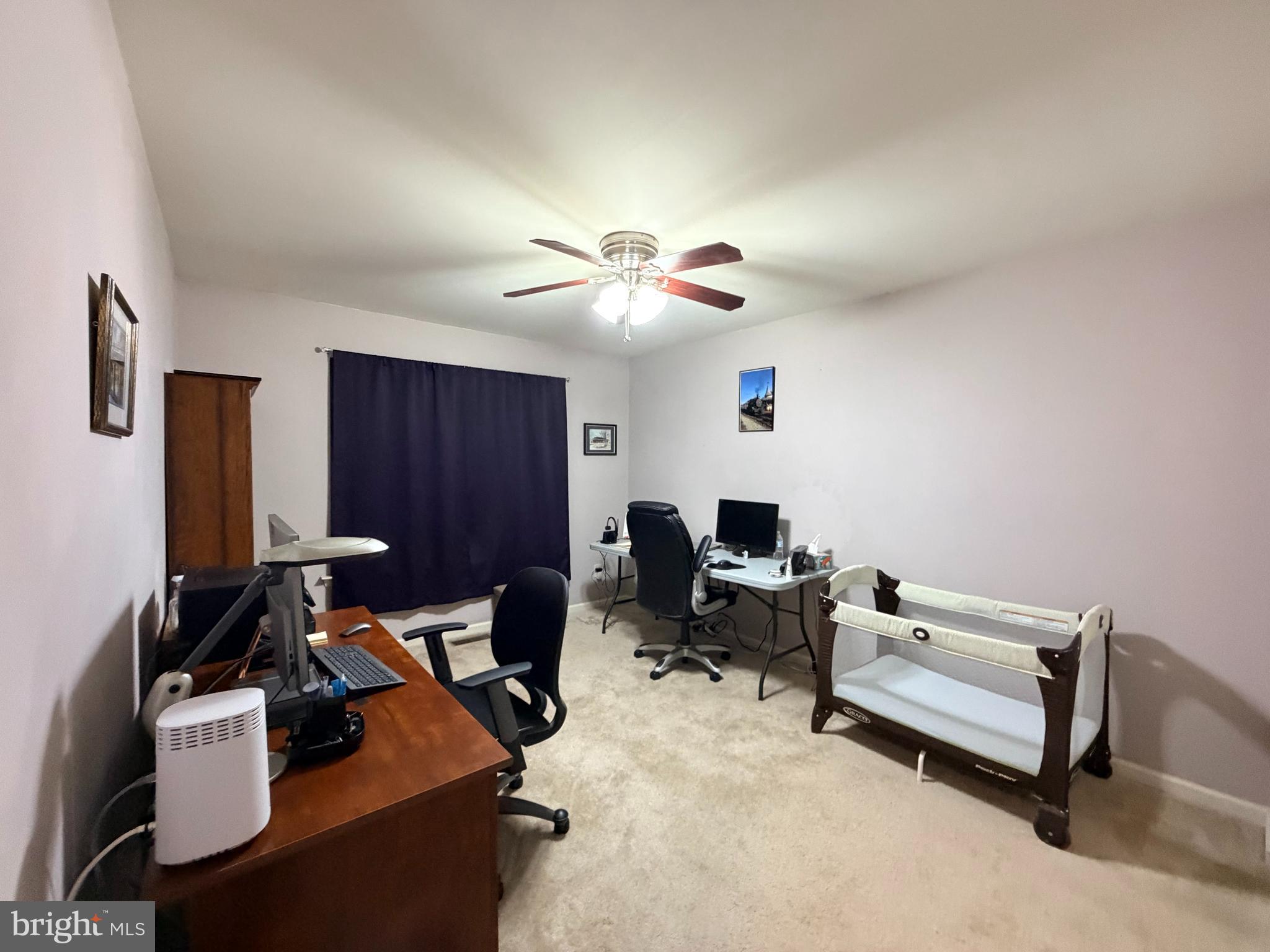 493 Buchanan Road Perkasie, PA 18944 - Photo 21 of 33 a livingroom with workspace and a couch