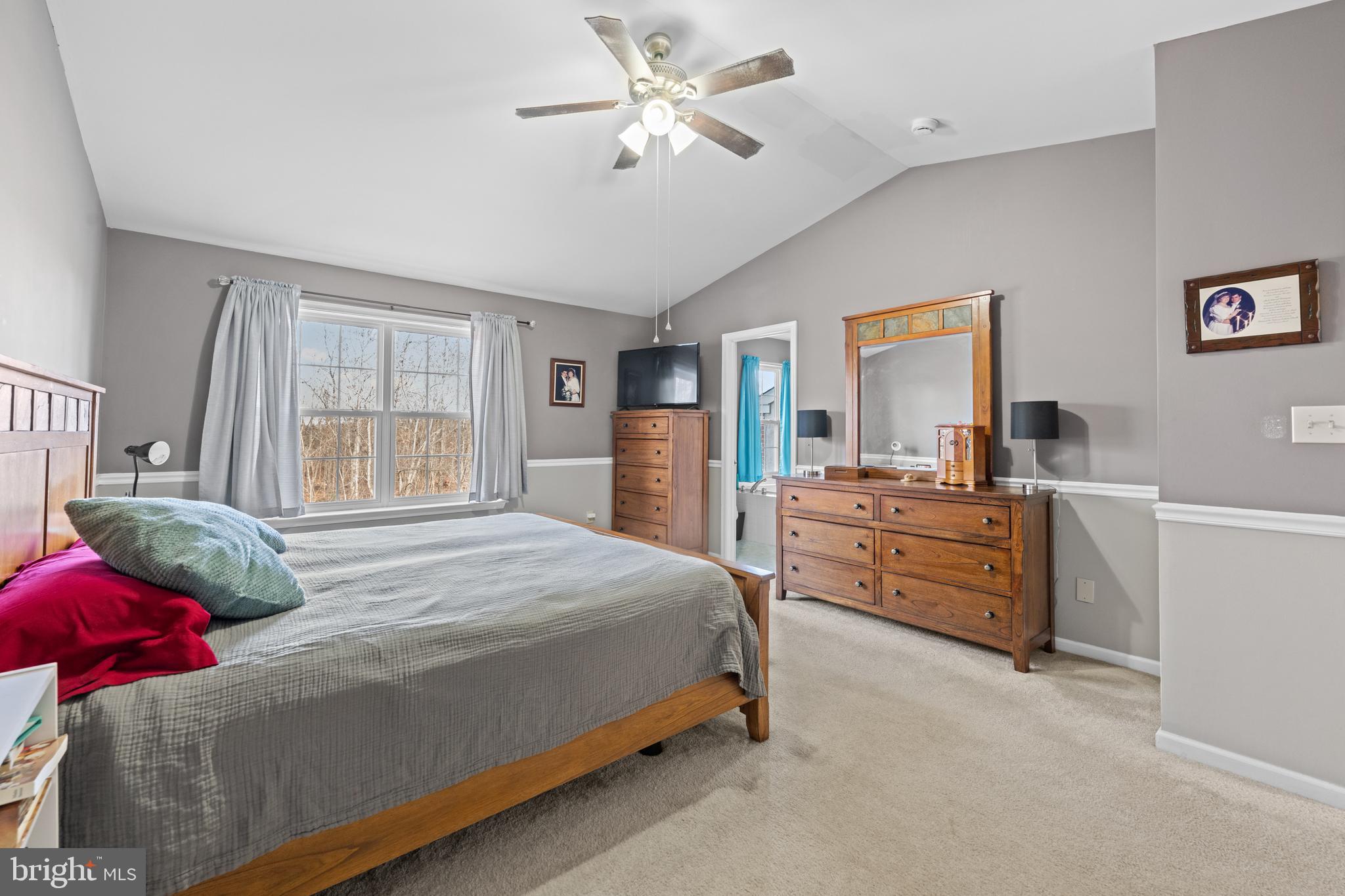 493 Buchanan Road Perkasie, PA 18944 - Photo 26 of 33 a bedroom with a bed and dresser with mirror