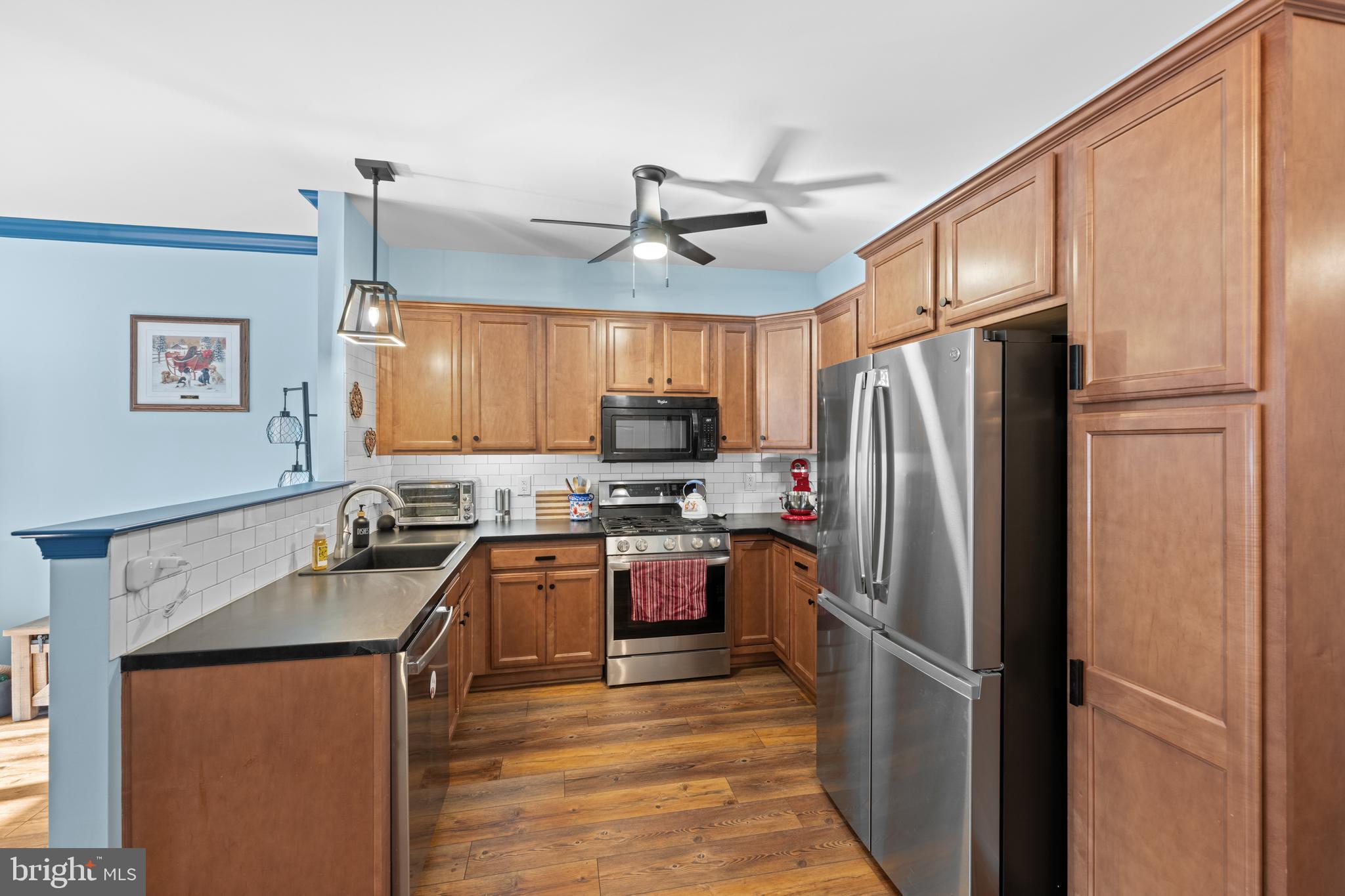 493 Buchanan Road Perkasie, PA 18944 - Photo 8 of 33 a kitchen with granite countertop stainless steel appliances a refrigerator stove top oven and sink