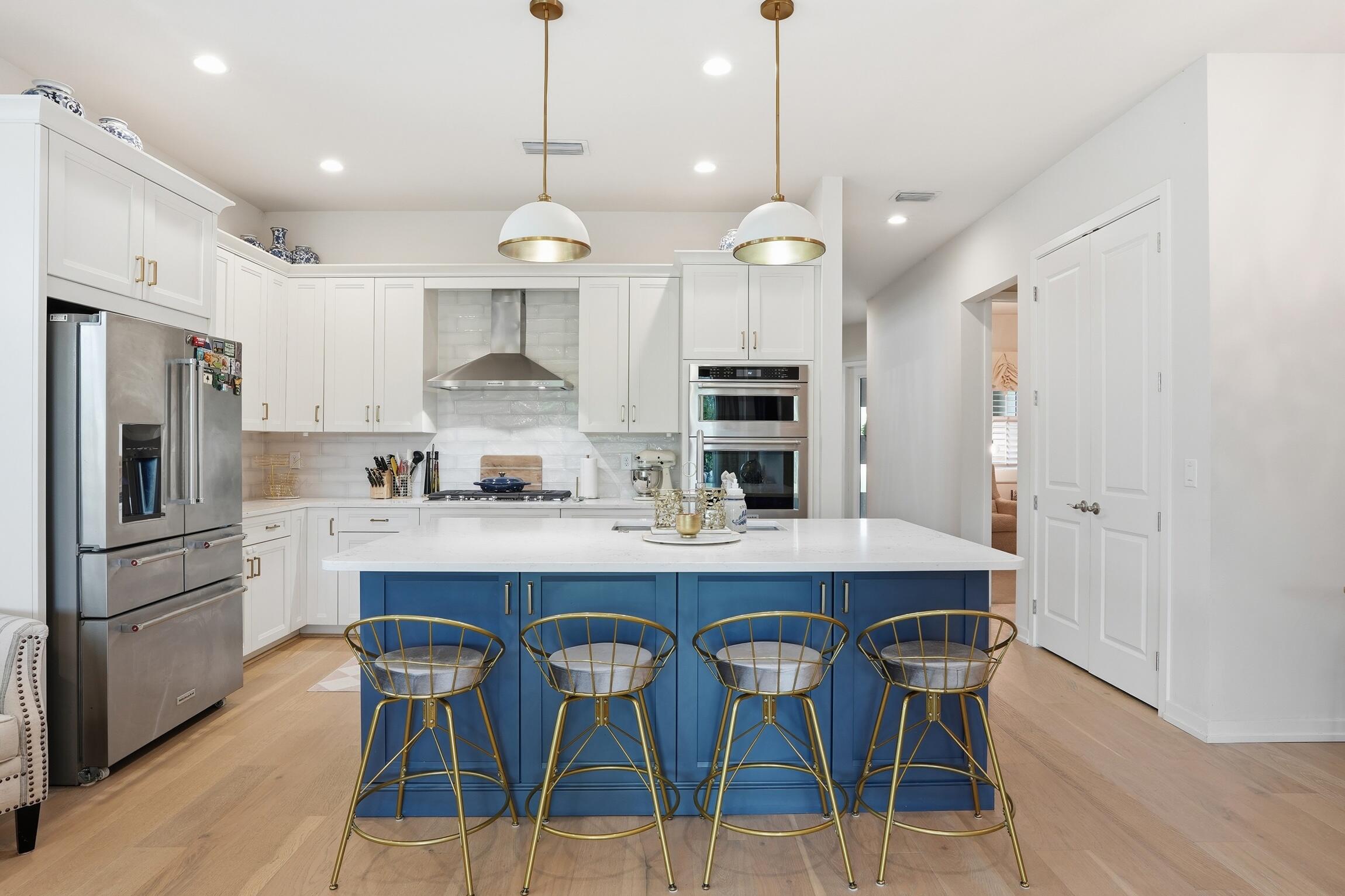 14708 Kingfisher Loop Naples, FL 34120 - Photo 11 of 42 a large kitchen with a table and chairs